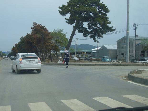 In many areas electricity is still unavailable and the traffic lights have malfunctioned.  Here, police officers from Hyogo prefectures in western Japan are directing traffic.